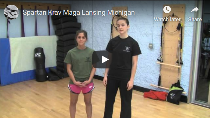 video of two students giving a testimonial about Spartan Krav Maga and the services at the location.